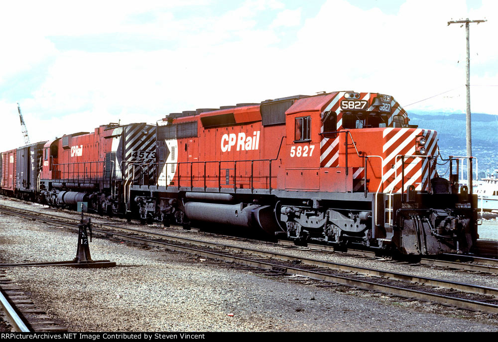 CP Rail freight heads east out of Vancouver with SD40-2 #5827 & MLW M630 4573.